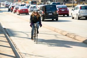 A cyclist riding in the bike lane on University Avenue in Madison