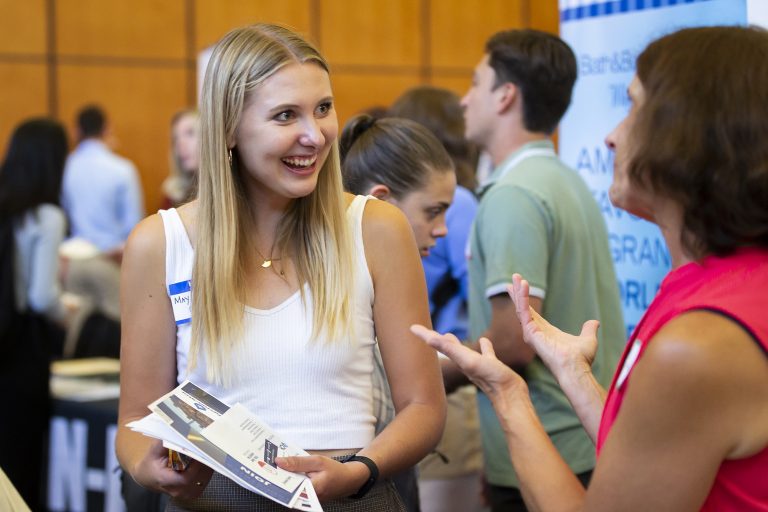 May Jagodzinski, a fourth-year undergraduate, talks to a recruiter at the Career and Internship Fair at Gordon Dining and Event Center at the University of Wisconsin–Madison on Sept. 20, 2022. (Photo by Taylor Wolfram / UW–Madison)