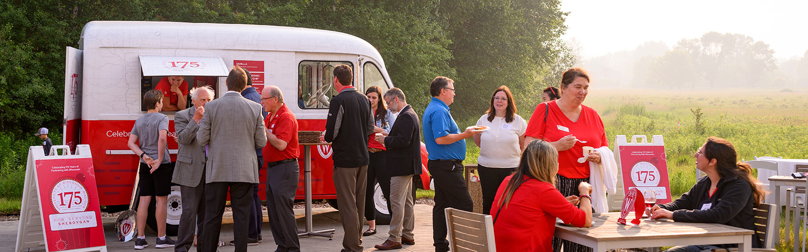 Guests mingle and order Babcock ice cream from the 175th anniversary–inspired ice cream truck at Kohler Communications in Kohler, Wisconsin on June 28, 2023.
