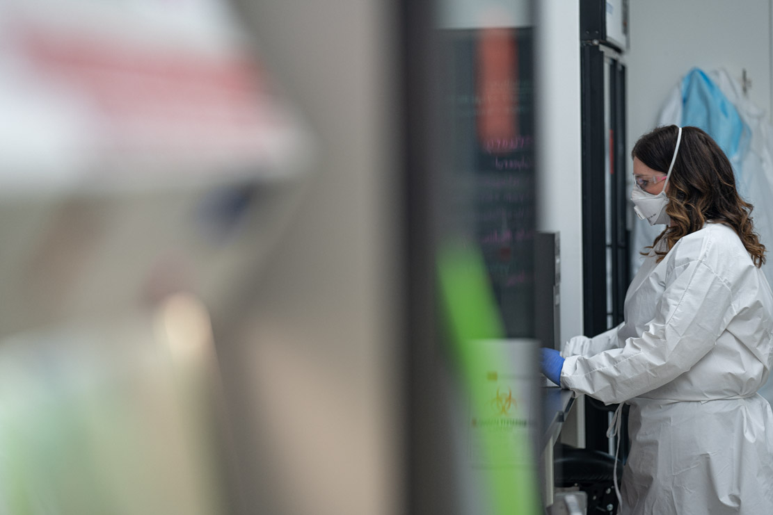 Scientist running test at state lab