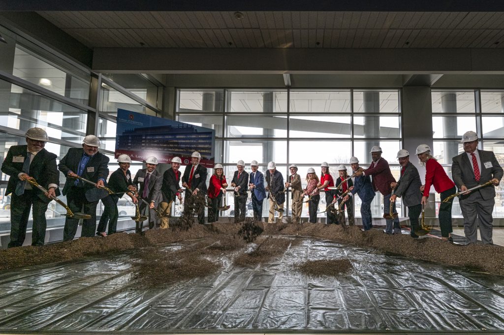 A ceremonial earth shoveling exercise during a College of Engineering groundbreaking ceremony for the Phillip A. Levy Engineering Center in 2025