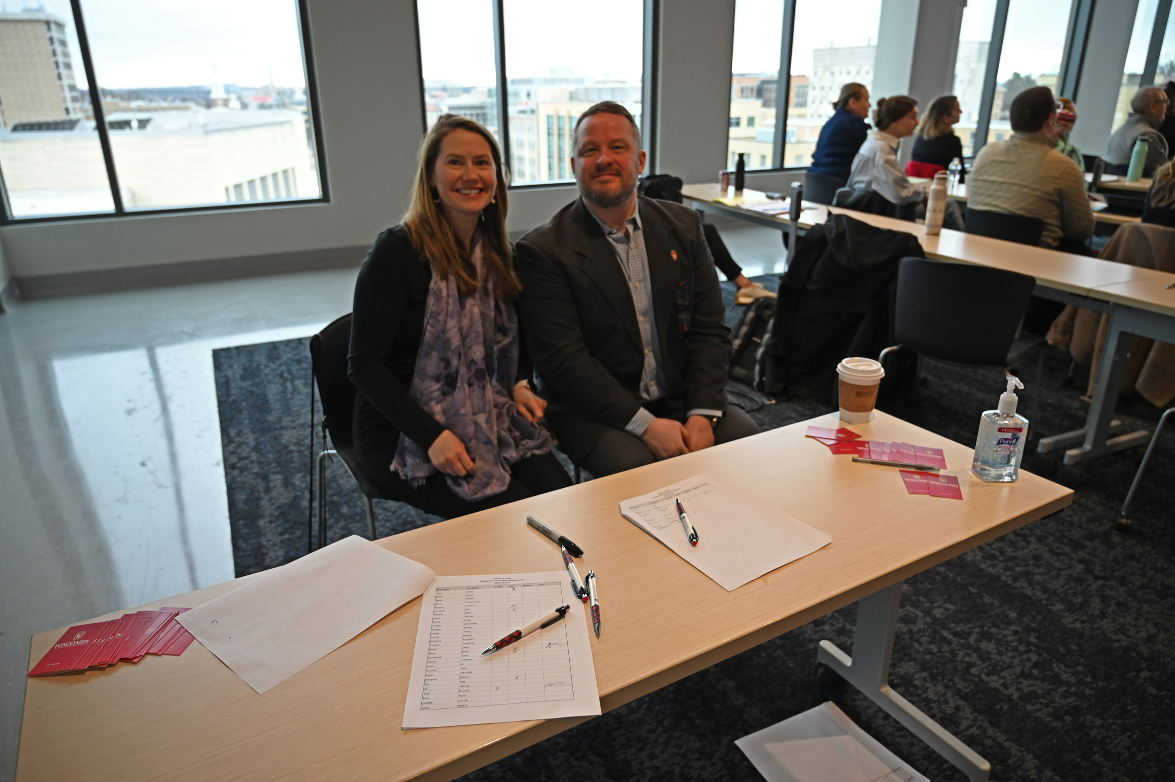 Kristin Isaac and Brendan Casey welcome attendees to the training session on March 10.